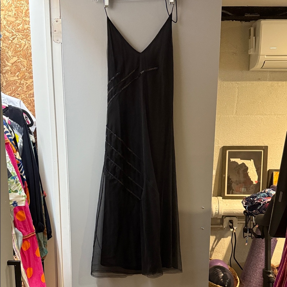 Poleci black cocktail dress with sequins detail.
